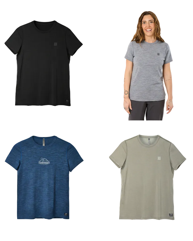 Four women's short-sleeve crew-neck athletic T-shirts shown in different colors: black, heather gray modeled on a woman, heather blue, and heather sage green. Each shirt has a small chest logo and a small hem tag.